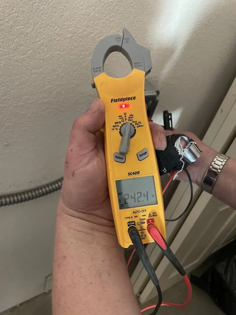 Voltage testing with clamp meter during Aluminum Wiring Replacement in Burton